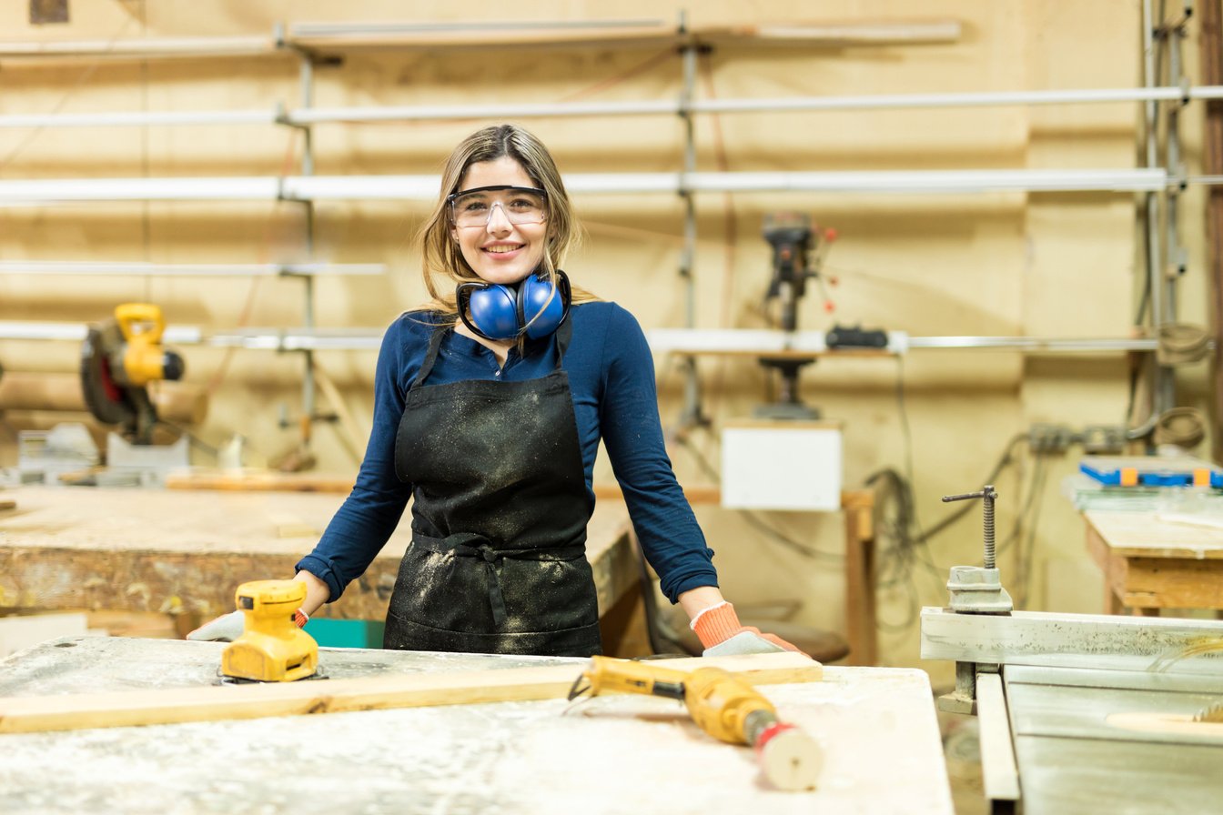 Beautiful carpenter in a woodshop